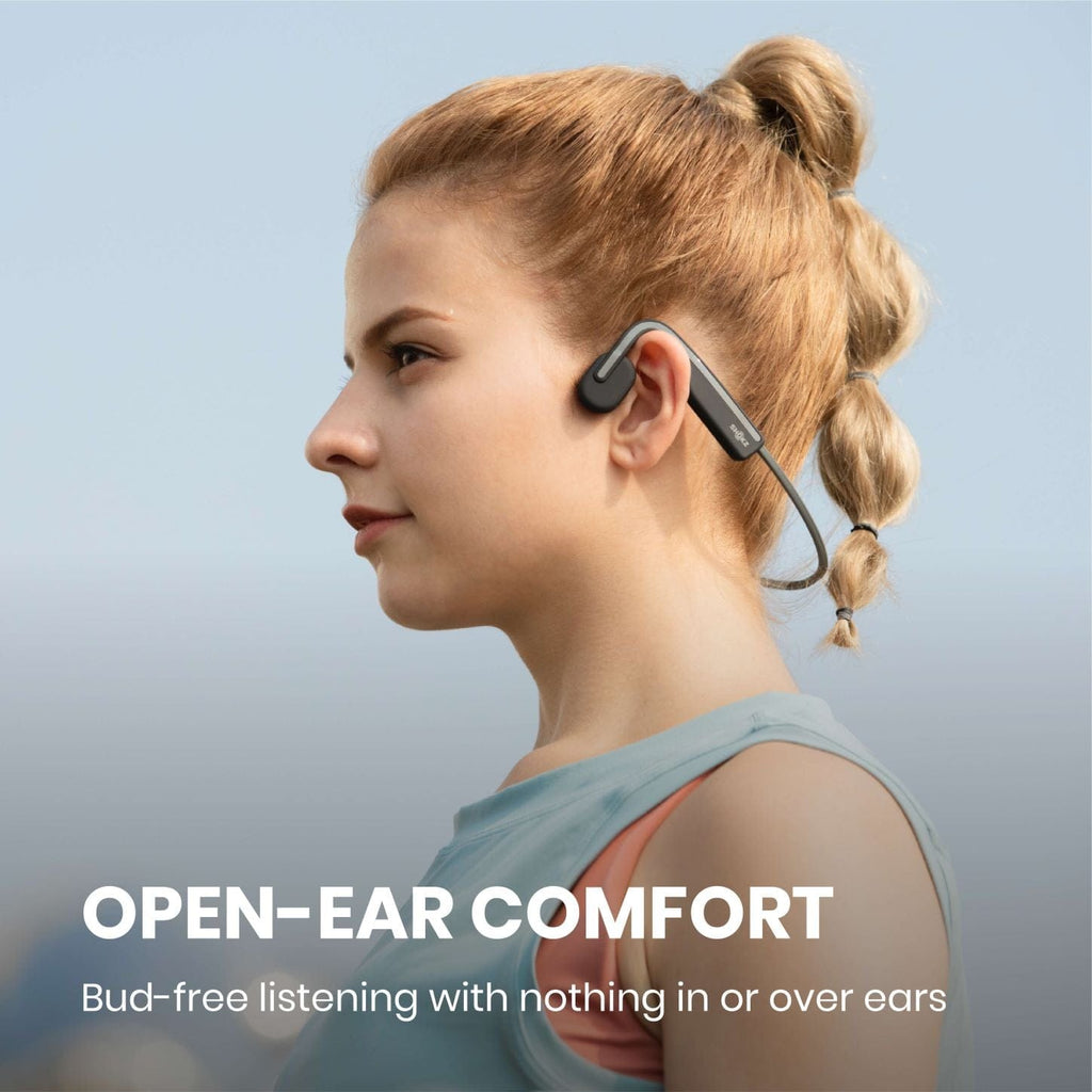 Model wearing the Shokz Openmove headphones